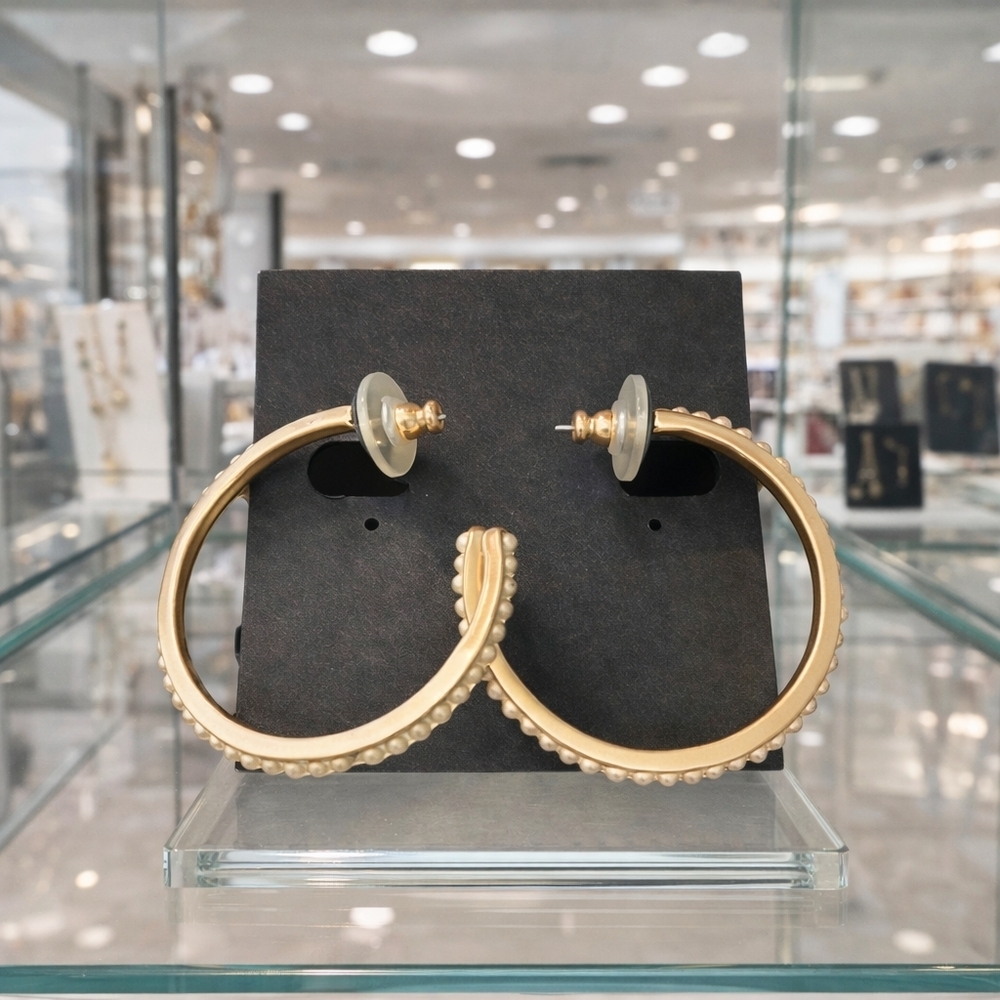 Gold half hoop earrings with pearl decor